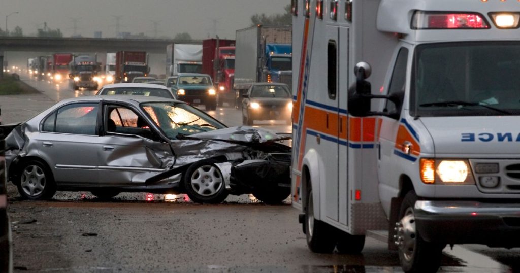 car accident on the highway with ambulance on scene