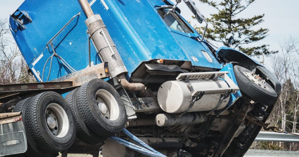 Overturned truck being flipped back over